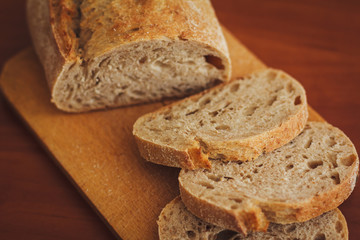 Bread on dark wooden background