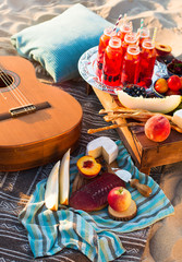 Picnic on the beach at sunset