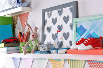 Shelves with toys in child room close-up
