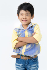 Little asian boy with smile face on gray background