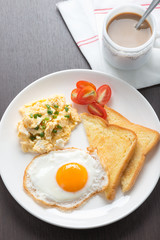 breakfast coffee, fresh fried egg and scrambled Egg with bread