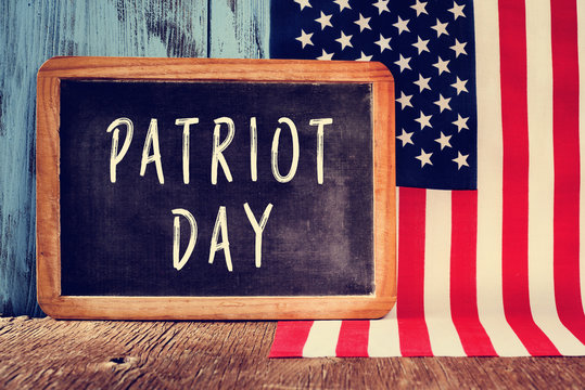 text Patriot Day in a chalkboard and the flag of the United Stat