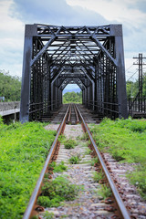 Fototapeta premium Old rail way bridge, Rail way construction in the country, Journey way for travel by train to any where. Old frame or construction. Concept go to success way.