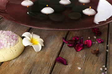 Beautiful spa composition with stones on table close up