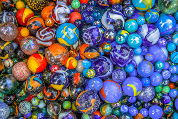 Fototapeta na wymiar Background of marbles in many color varieties