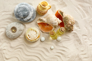 Stack of spa stones on sand background