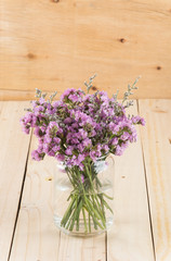 statice flower bouquet  on wood background