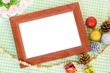 Wooden photo frame and christmas decoration with flower.