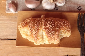 Garlic bread of herb delicious on wood background.