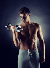 young man with dumbbell