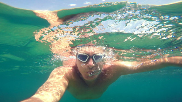 swimming under the water in a clear sea