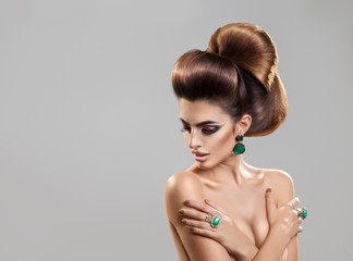 Horizontal portrait of young fashion model with creative hairsty