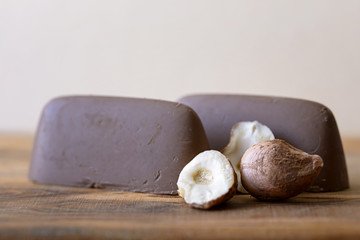 macro chocolate and hazelnut on wood
