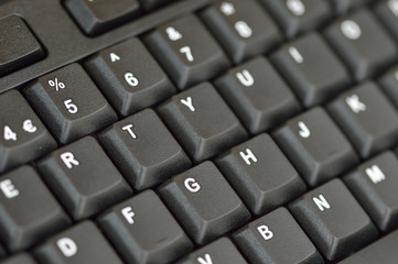 Computer keyboard. Close up of keys on an angle. Bottom left to top right.