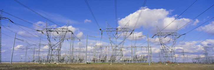 Electrical pylons in front of transformers
