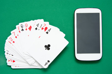 Poker cards and mobile phone