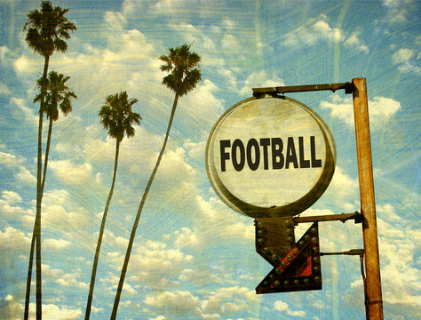 Aged And Worn Vintage Photo Of Football Sign With Palm Trees