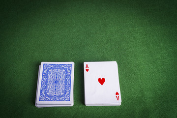 Split pack of playing cards showing Ace of Hearts