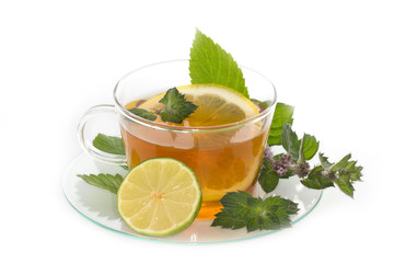 Cup of tea with lemon and mint isolated