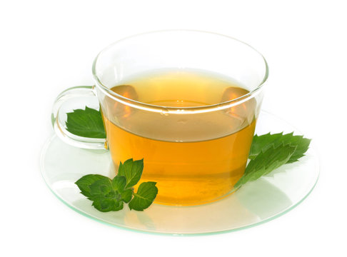 Cup of tea with lemon and mint isolated