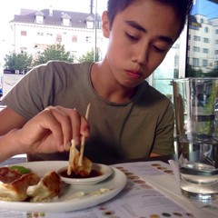 boy eating with chopsticks