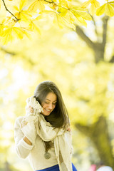 Young woman in autumn forest