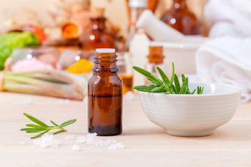 Fototapeta na wymiar Natural Spa Ingredients rosemary essential oil for aromatherapy
