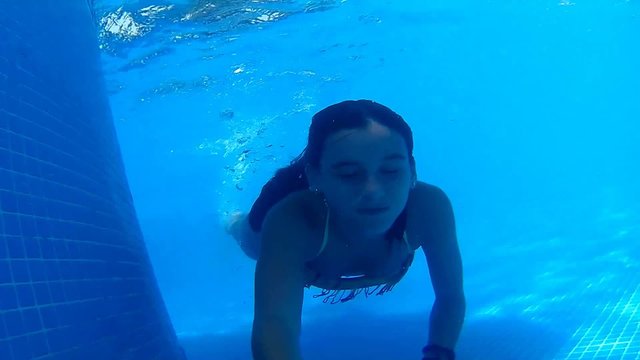 Girl swims underwater