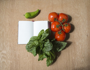 Champignon, hot peppers, yellow pepper, red tomato, savoy on wood background