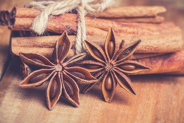 Cinnamon sticks on wooden background