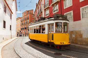 tram on narrow street of Alfama, Lisbon - obrazy, fototapety, plakaty