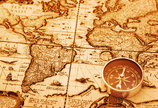 Compass on vintage map background