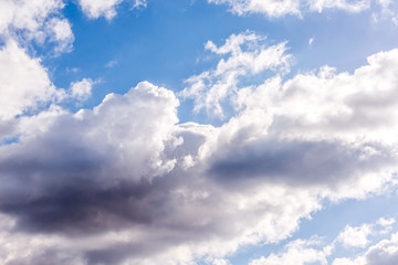 Blue skies raining clouds