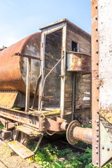Fototapeta na wymiar Old rusty, tank wagon, with cab, brake and wheels detail