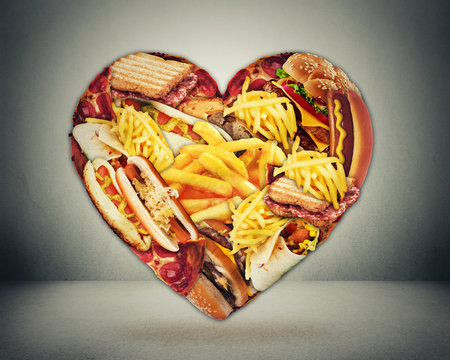 Heart and bad diet stroke risk concept. Heart shaped of fast junk fatty food