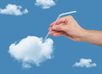 Hand putting a straw in a puffy cloud