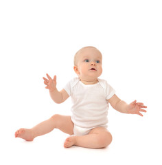 Infant child baby toddler sitting hands up surprised