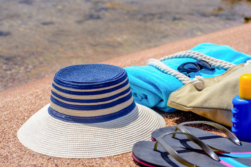 Assorted beach accessories on the sand