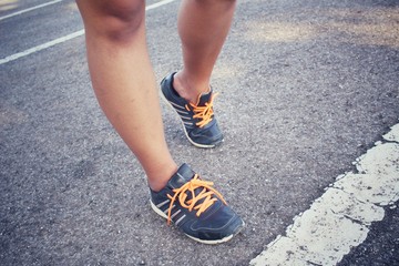 Fototapeta na wymiar Woman with shoes running