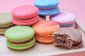 Wooden dish of Sweet and colourful french macaroons