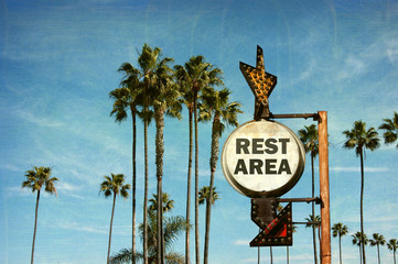 aged and worn vintage photo of rest area sign