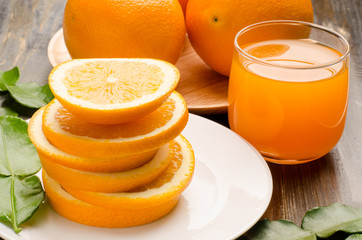 Navel orange fruit and juice on wooden background