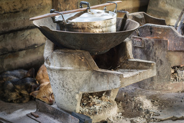 Wood stoves or Charcoal grills and pots in the kitchen of people
