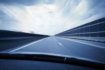 Car view with motion blur road background