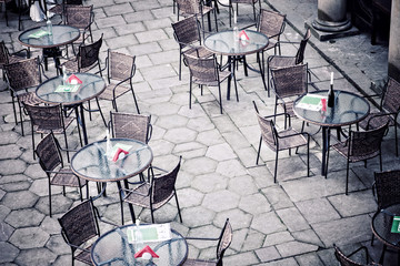 Street cafe terrace with tables and chairs in European city