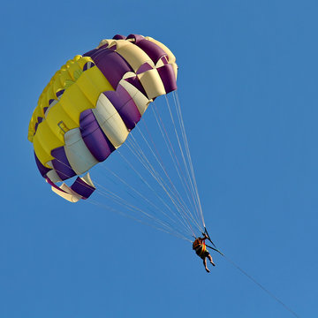 Parasailing in a blue sky