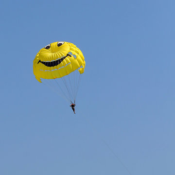 Parasailing in a blue sky