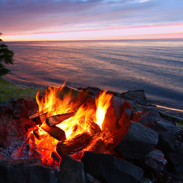 Sunset camp fire along the beach of Lake Superior in Michigan