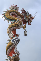 Fototapeta na wymiar Chinese dragon on the red pole
