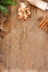 Homemade baked Christmas gingerbread tree on vintage wooden back